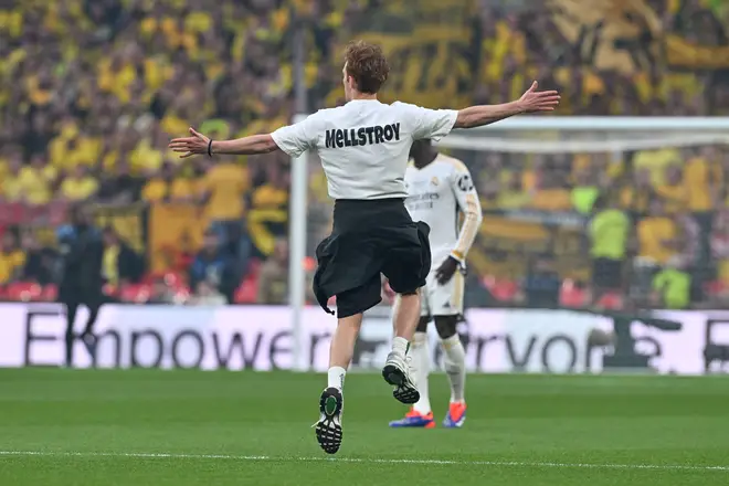 The pitch invaders were wearing t-shirts with 'Mellstroy' written on.